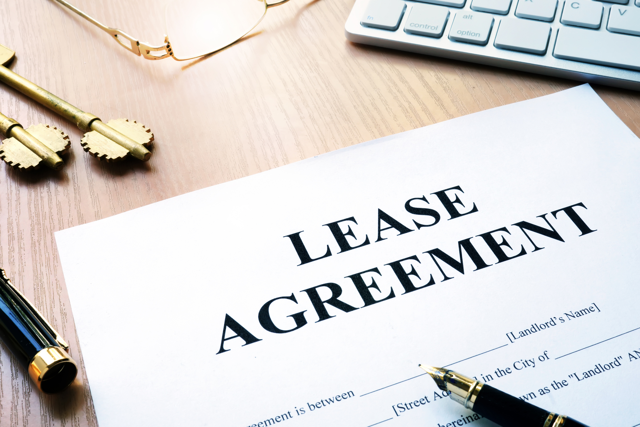 Rental lease agreement form on an office desk. Rental lease agreement form on an office desk.