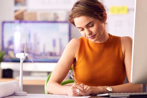 Future_Skills_Blog woman writing at desk