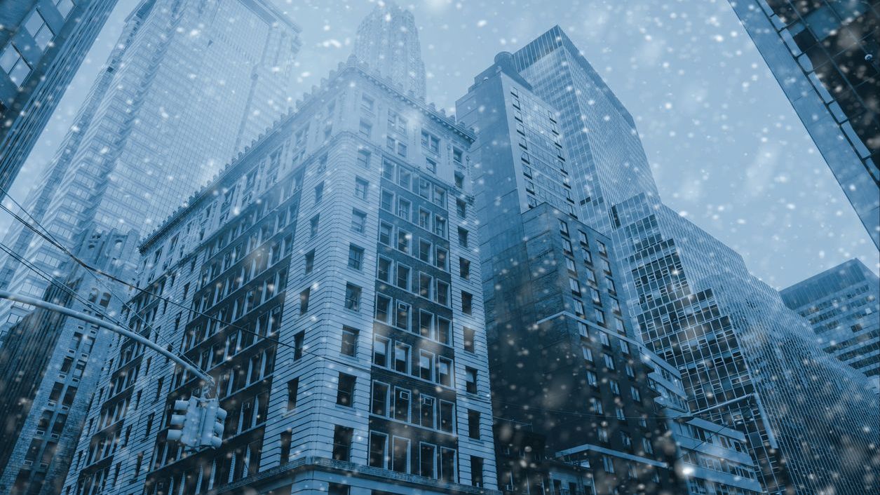 Famous Wall Street in New York City, Christmas time – snow winter blue background Famous Wall Street in New York City, Christmas time - snow winter blue background. NYC, USA